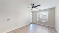 Located at 3145 Prado Ln in Charlotte, NC, this well-appointed one-bedroom, one-bathroom unit offers a thoughtfully designed single-floor layout with modern finishes throughout. Light wood-style flooring flows seamlessly across the entire space, creating a cohesive and clean aesthetic.

The open-concept kitchen and living room serve as the heart of the home. The kitchen is outfitted with white shaker-style cabinetry, dark quartz countertops, a herringbone tile backsplash, stainless steel appliances including a refrigerator with ice maker, electric range, built-in microwave, and dishwasher, along with a pendant light fixture that adds a contemporary touch.

The living area is bright and airy, benefiting from large windows with blinds and a ceiling fan with integrated lighting. A private door leads to the patio, extending the living space outdoors. The hallway connects all areas efficiently, maintaining an organized flow throughout.

The bedroom is a comfortable retreat featuring a ceiling fan, a large window that invites natural light, and direct access to a well-organized walk-in closet with built-in shelving and hanging rods. The full bathroom includes a white vanity with a stone-topped countertop, subway-tiled tub-shower combination with a sliding glass door, and light wood-style flooring consistent with the rest of the unit.