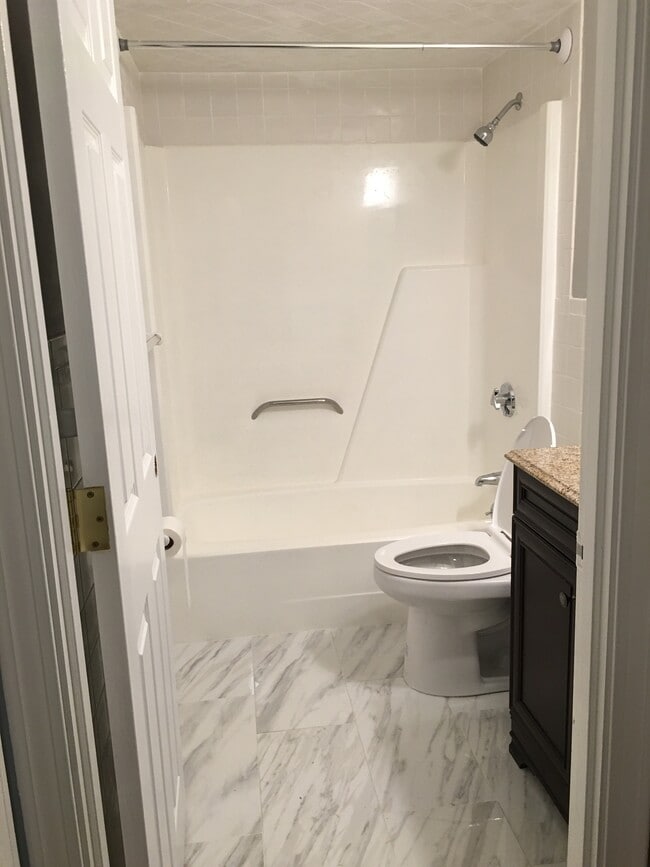 Brand new toilet and floor in bath - 90 Neponset St