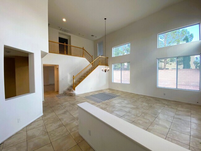 Building Photo - Large family home in the Eldorado Community! Home has a living room with a high ceiling, a den th...