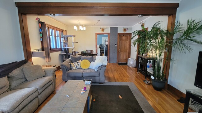 living room facing kitchen and entry door - 1019 Widdicomb Ave NW