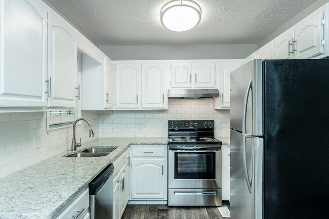 Gorgeous Granite Countertops with Modern Subway Tile Backsplash - Woodland Manor