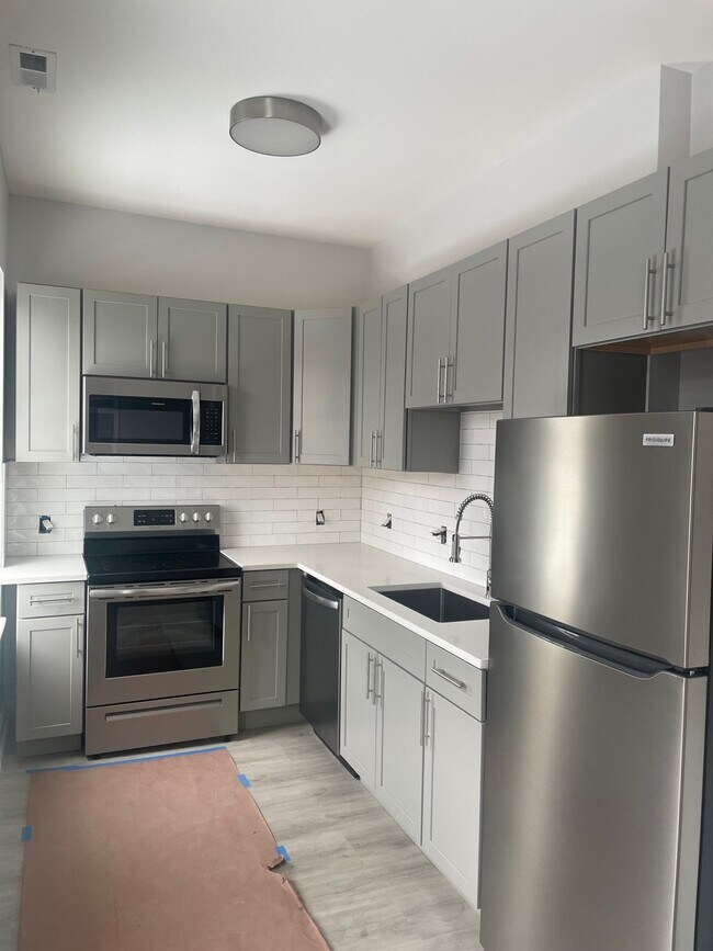Kitchen with Stainless Steel Appliances - 216 Findlay St Apartments