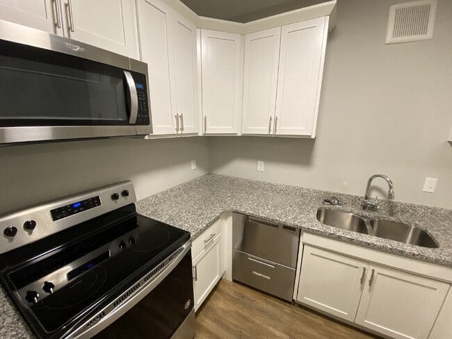 Building Photo - Modern Comfort Meets Urban Convenience in ...