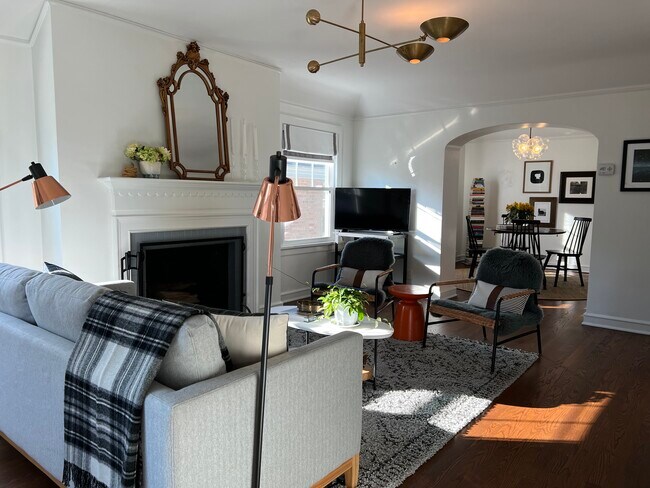 Light filled living room with working woodburning fireplace - 4479 N Woodburn St