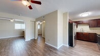 Located in Houston's desirable 77008 zip code, this one-bedroom, one-bathroom home offers a well-organized, single-story layout with a functional and cohesive design. Wood-look tile flooring runs throughout the entire space, providing a warm, consistent aesthetic that ties each room together.

The open living area welcomes natural light through sizable windows fitted with blinds, complemented by a ceiling fan overhead. A front entry door opens directly into this bright, airy space. The kitchen flows seamlessly from the living area and features rich, dark-stained cabinetry, granite-look countertops, a stainless steel refrigerator, stove, and built-in microwave, along with a double-basin sink — making it a well-appointed space for everyday cooking.

The bedroom is a comfortable, quiet retreat with its own ceiling fan and a window allowing in natural light. A dedicated closet with a hanging rod provides practical storage. The bathroom includes a glass-enclosed shower stall and continues the wood-look flooring, maintaining a clean, uniform look. A separate closet space adds additional storage to the layout.

Neutral warm-beige walls throughout create a calm, move-in-ready atmosphere, making this home a practical and appealing option in the Houston area.