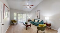 Located at 1600 Eldridge Pkwy in Houston, TX, this single-story, 3-bedroom, 2-bathroom home offers a thoughtfully designed layout with a welcoming ambiance. The entryway features rich hardwood flooring and a large double-door closet, opening into a combined living and dining area. The living room is highlighted by soaring vaulted ceilings, a ceiling fan, plush carpeting, and a sliding glass door that invites abundant natural light and outdoor views. The adjoining dining area is anchored by a white-mantled fireplace with a tile surround and a distinctive arched wall niche, adding architectural character. The kitchen is well-equipped with warm wood cabinetry, granite-style countertops, stainless steel appliances, a breakfast bar, and hardwood flooring. An in-unit stacked washer and dryer is conveniently tucked nearby. The generously sized primary bedroom features carpet, vaulted ceilings, and an elegant arched window with a built-in ledge. The additional bedrooms offer comfortable proportions and ample closet space. The bathrooms include warm wood vanities, white countertops, and hardwood-style flooring. Throughout the home, a neutral color palette and consistent finishes create a cohesive and inviting atmosphere.
