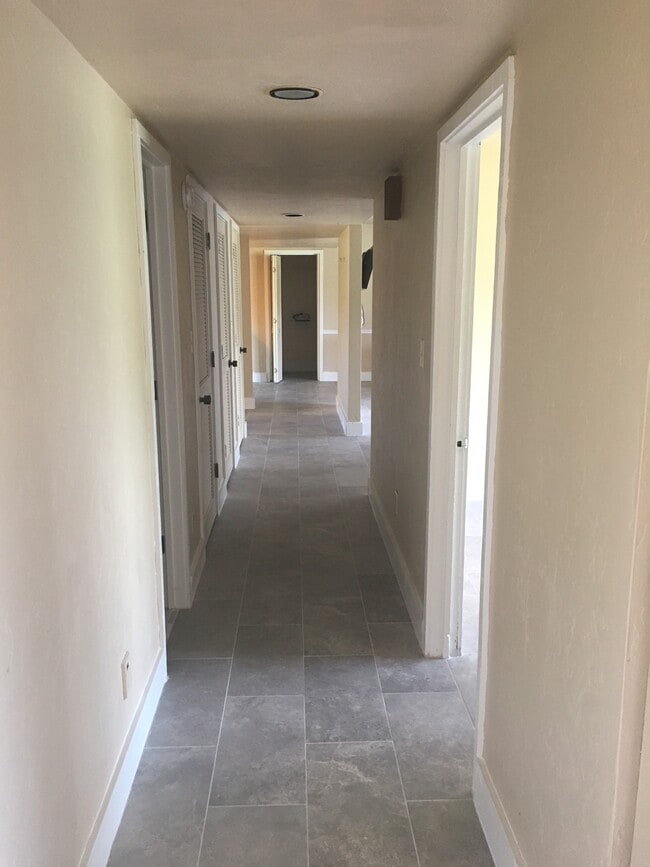 Even the hallway has been retiled; you won't find any carpet in the entire unit. - 4193 Abbey Court