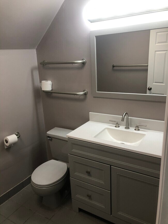 Bathroom with new vanity and mirror - 125 Evergreen Ave
