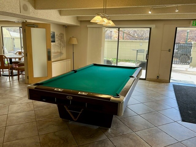Pool table in building common room. - 777 N Washington St