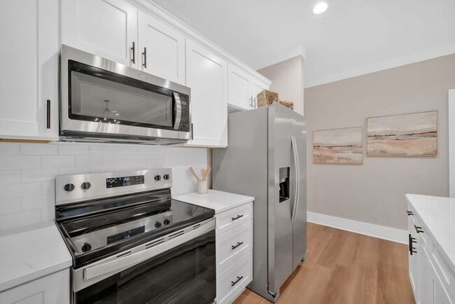 Building Photo - Ground-Level Living. Private Garage. Bonus Space Below.