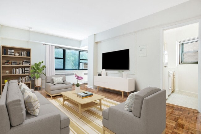 Studio apartment living area (virtually staged) - The Diplomat