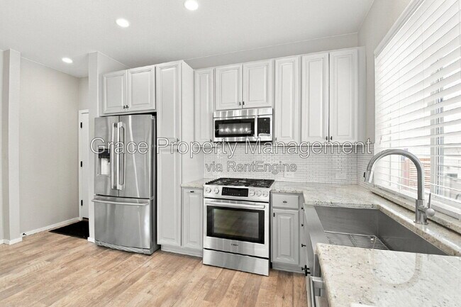 Building Photo - 1658 W 66th Ave