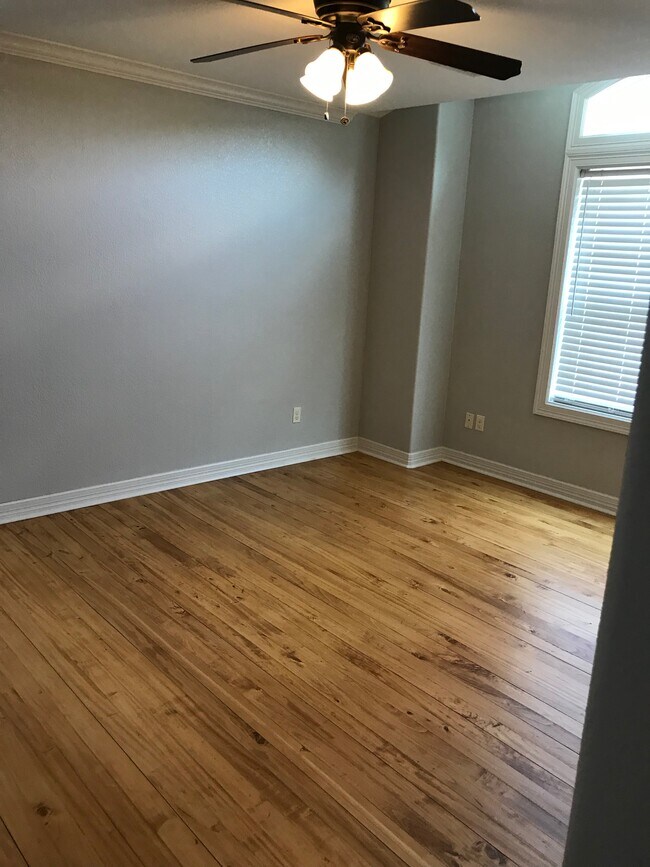 Master bedroom with hardwood floors - 604 South Ave A