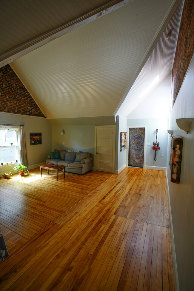 Airy living room with high ceilings and skylight - 536 Cumberland Ave