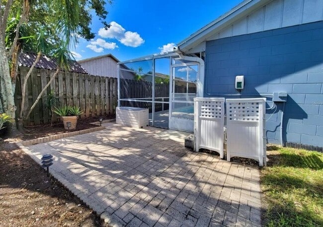Building Photo - Charming 3-Bedroom Home with Pool, 2-Car Garage, and Tile Flooring Throughout!
