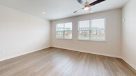 Located at 1320 Caprice Dr in Lakeland, FL, this well-designed one-bedroom, one-bathroom unit offers a thoughtfully organized single-floor layout. The open-concept kitchen and living area serves as the heart of the home, featuring white shaker cabinetry, granite countertops, a center island with an undermount sink, and a full suite of stainless steel appliances including a refrigerator, electric range, and microwave. Wood-style plank flooring flows throughout the entire unit, providing a clean and cohesive aesthetic. Recessed lighting and ceiling fans enhance comfort in both the kitchen-living area and bedroom.

The bedroom is a comfortable, well-proportioned retreat bathed in natural light from multiple windows with outdoor views of the surrounding community and waterfront. Two closets provide generous storage, including a walk-in closet outfitted with wire shelving. The bathroom is finished with granite countertops, white cabinetry, a tiled tub-shower combination, and wood-style flooring that continues the unit's consistent design language. Neutral wall tones and clean architectural lines throughout the space create a bright, modern ambiance suited for comfortable everyday living.