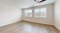 This contemporary 730 square foot apartment in Lakeland, FL, offers a harmonious blend of style and functionality. The open-concept design seamlessly integrates the kitchen and living areas, creating a spacious feel. Large windows flood the rooms with natural light, while modern ceiling fans ensure comfortable air circulation.

The kitchen is a highlight, boasting crisp white cabinetry, granite countertops, and stainless steel appliances, including a refrigerator, stove, and built-in microwave. A central island with a sink adds extra prep space and potential for casual dining.

The bedroom, measuring 150 square feet, features ample space and is equipped with a sizable closet for storage. The bathroom continues the modern aesthetic with a granite-topped vanity, large mirror, and a shower/tub combination.

Throughout the apartment, warm-toned wood-look flooring adds warmth and durability. Two additional closets provide extra storage options. The neutral color palette and clean lines create a canvas for personal style.

This single-floor unit at 1320 Caprice Dr offers a perfect balance of comfort and contemporary design, ideal for those seeking a stylish, low-maintenance living space in Lakeland.