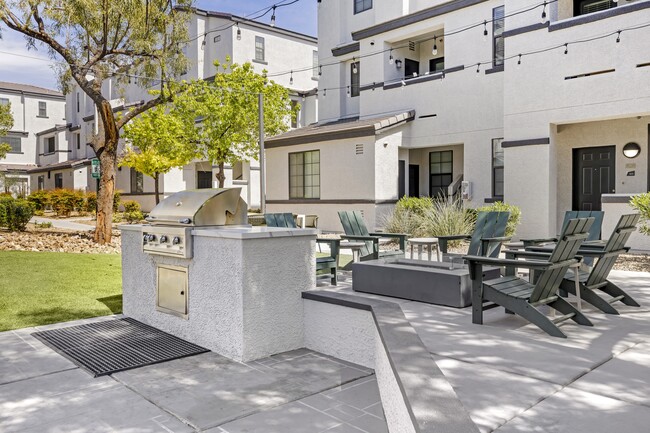 Grill, chill, and unwind in style at the Michael B apartment complex's inviting outdoor patio, where good times and great food come together seamlessly. - The Michael B Townhomes and Flats