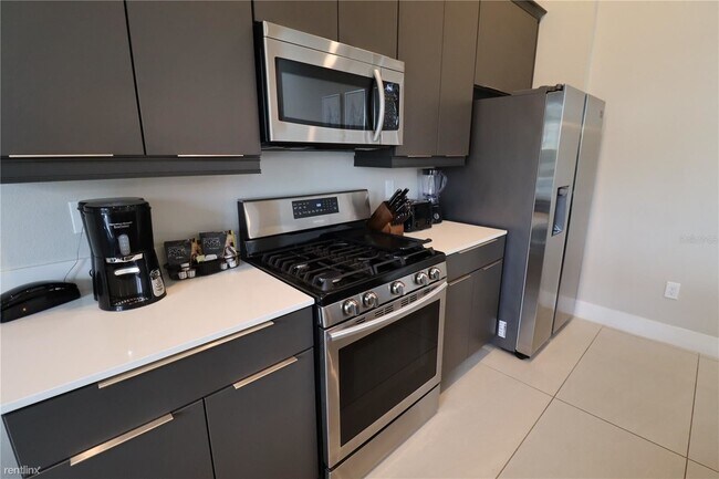 Foto del edificio - 4 br, 3.5 bath Condo - 7740 Sandy Ridge Dr...