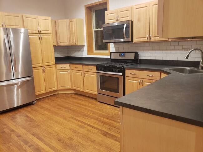 Kitchen next to In Unit Laundry - 1425 N Washtenaw Ave