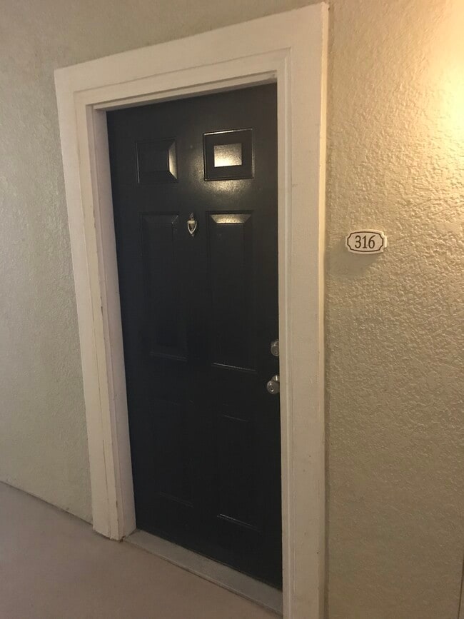 Front Door- Door has been updated to electronic lock system - 8290 Gate Pkwy W