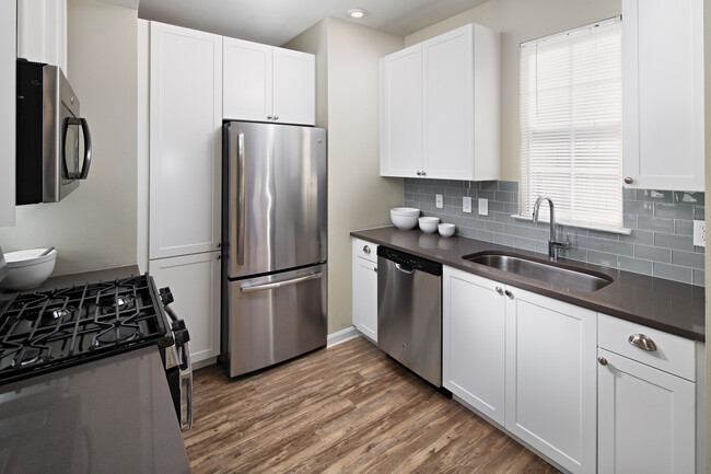 Kitchen with Tile Backsplash - Avalon at Florham Park