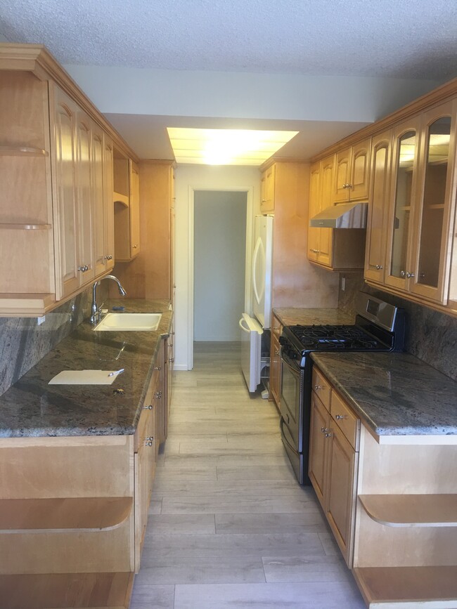 kitchen with granite countertops - 11820 Mayfield Ave