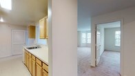 Fox Hill Run 208C is a thoughtfully laid-out single-floor residence that offers a clean, functional living environment. The expansive living area is carpeted in warm neutral tones and is bathed in natural light through large windows and a sliding glass door that opens to a private balcony, providing views of the surrounding community. The galley-style kitchen features light wood cabinetry with ample upper and lower storage, white countertops, a stainless steel sink, and white appliances including a gas range, refrigerator, and built-in microwave. Overhead skylight-style lighting brightens the space throughout the day. The bedrooms are generously sized with plush carpeting, large windows, and dedicated closet space, providing a comfortable and private retreat. One bedroom includes an en-suite bath, while an additional full bathroom serves the rest of the residence. Both bathrooms are finished with tile flooring, vanities with wood cabinetry, wide mirrors, and tub-shower combinations with sliding glass doors. The overall design is neutral and move-in ready, offering a versatile canvas well-suited to a variety of living arrangements.