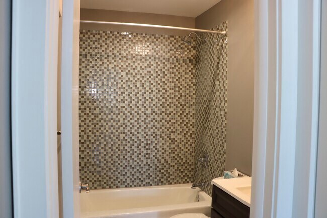 Remodeled bathroom with shower over tub - 2174 Division St