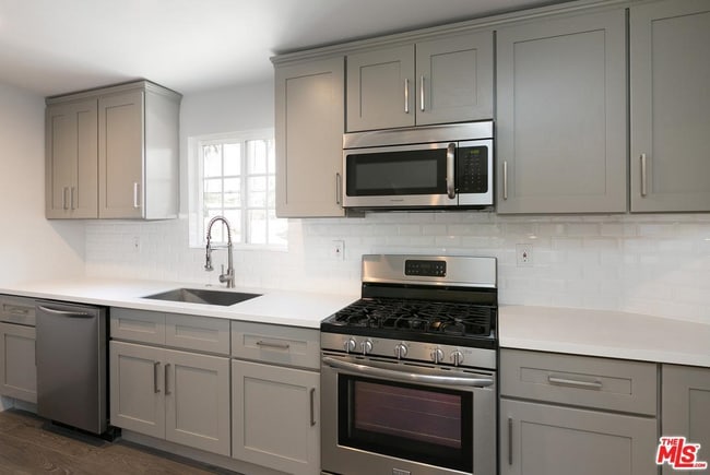 Kitchen with stainless steel appliances - 130 S Hoover St