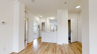 Located at 2242 Gill Village Way in San Diego, CA, this two-bedroom, one-bathroom residence offers a well-designed single-floor layout with a comfortable and functional flow throughout. The open-concept living and dining area features a combination of warm wood-look flooring and plush carpeting, a ceiling fan, and a tiled fireplace that serves as a welcoming focal point. Large windows allow natural light to fill the space, enhancing its bright and airy atmosphere.

The kitchen is thoughtfully designed with white cabinetry, stone-look countertops, stainless steel appliances including a refrigerator, electric range, and microwave, and a peninsula with a sink that opens toward the living area—ideal for both cooking and entertaining.

The primary bedroom is generously sized, carpeted for comfort, and features a ceiling fan and windows with outdoor views of surrounding greenery. The second bedroom is equally bright with its own ceiling fan and closet access. A dedicated walk-in closet adds practical storage.

The bathroom is clean and modern, featuring wood-look flooring, a vanity with a white countertop, a large mirror, and a full tub-shower combination with ample natural light from a nearby window. Overall, the space exudes a light, neutral aesthetic throughout.