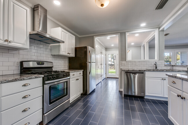 Beautiful kitchen! LOADS of storage! New large microwave, gas stove, dishwasher, disposal. - 8738 Glencrest Ln