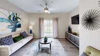 This 890 square foot home in Columbus, Ohio offers a well-designed living space with two bedrooms and two bathrooms. The single-story layout maximizes functionality, featuring an open-concept kitchen and living room that creates a spacious feel. The primary bedroom, measuring 150 square feet, provides ample space for comfort.

The interior boasts modern finishes, with light-colored walls and wood-look flooring throughout. Large windows in the bedrooms and living area allow for natural light, while stylish ceiling fans enhance air circulation. The bathrooms are equipped with contemporary fixtures, including a combination bathtub-shower in one and a vanity with ample counter space in the other.

The kitchen features stainless steel appliances, white cabinetry, and a double-basin sink, ideal for meal preparation and clean-up. A dedicated laundry room adds convenience to daily life. The attached garage offers secure parking and additional storage space.

Tasteful decor elements, such as modern artwork and strategically placed mirrors, contribute to the home's aesthetic appeal. The property's efficient use of space, coupled with its modern amenities, makes it an attractive option for those seeking a comfortable, low-maintenance living environment in Columbus.