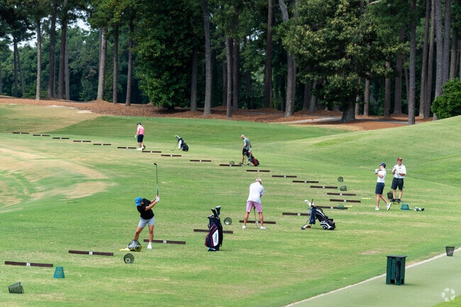 The Duke Golf Club in Duke Forest has a large driving range that fills up during good weather.