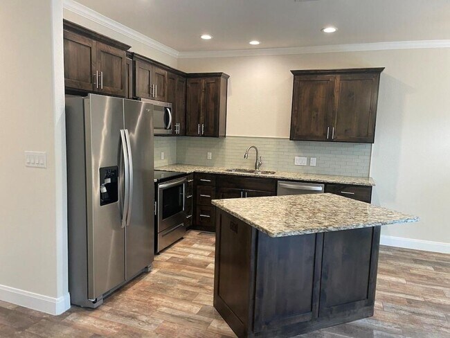Building Photo - Enjoy the upscale construction of this pro...