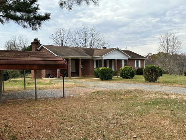 Building Photo - 4-Bedroom Brick Home with Full Unfinished ...
