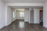 Located in the desirable Colonial Homes neighborhood of Atlanta, GA, this two-story residence offers a well-organized layout across two floors. The main level features generously sized living areas finished with light-toned hardwood-style flooring that runs throughout, complemented by neutral white walls and multiple windows fitted with blinds that allow abundant natural light. An open flow connects the living spaces, with a staircase leading to the upper level. The kitchen is thoughtfully appointed with white shaker-style cabinetry, granite countertops, a light glass subway tile backsplash, stainless steel appliances including a gas range, microwave, dishwasher, and refrigerator, as well as track lighting overhead. The bathroom features white subway tile surrounding the tub-shower combination, a white vanity with granite countertop, and a wall-mounted mirror with lighting. The upper floor houses multiple bedrooms, each finished with plush carpeting, ceiling fans with lighting, and individual closets providing ample storage. Large windows in the bedrooms frame views of the surrounding neighborhood. The overall ambiance throughout the home is bright, clean, and move-in ready, reflecting a fresh, updated interior well-suited to comfortable urban living in Atlanta.