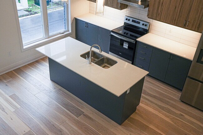 Building Photo - Modern Urban Towns Now Leasing!