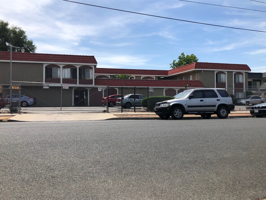Street view of the property with gated parking - 798 S Orange Ave