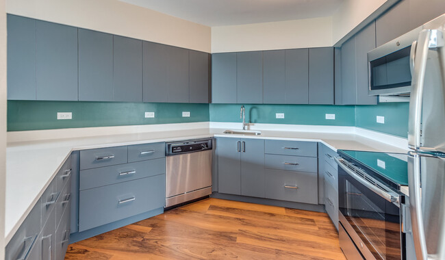 Upgraded kitchens with ample counter and cabinet space - Evanston Place