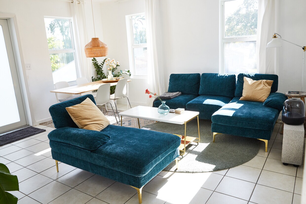 Living room with couch set and dining table - 6873 NW 2nd Ave