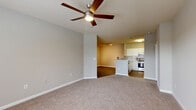 Located at 500 Briarvista Way in Atlanta, GA, this well-appointed 2-bedroom, 2-bathroom single-story residence offers a functional and comfortable layout. The open-concept living, dining, and kitchen area serves as the heart of the home, with plush carpet in the living space, a ceiling fan overhead, and a seamless transition to the kitchen via an elegant arched entryway. Wood-look flooring runs through the kitchen and hallways, adding warmth and continuity throughout.

The kitchen is well-equipped with white cabinetry, granite countertops, stainless steel appliances including a gas range and dishwasher, and a breakfast bar that opens to the dining and living areas. A pantry provides additional storage. Track lighting illuminates the space effectively.

Both bedrooms are generously sized and carpeted, each featuring ceiling fans and large windows that invite natural light and outdoor views of the surrounding neighborhood. The primary bedroom offers a notably spacious footprint with ample closet space. The two bathrooms are finished with granite vanity tops, white cabinetry, and wood-look flooring, with a tub-shower combination. A dedicated in-unit laundry room with side-by-side washer and dryer hookups adds everyday convenience. Multiple closets throughout the home ensure abundant storage.