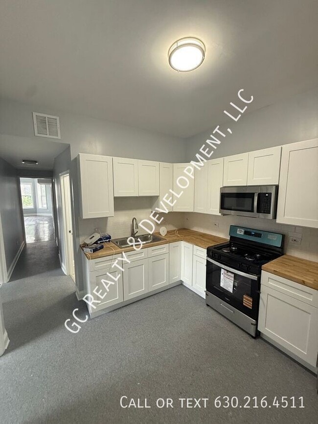 Building Photo - 6433 S Vernon Ave