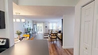 Located at 495 Laurel Hill Rd in Norwich, CT, this single-floor residence offers a thoughtfully arranged layout encompassing a living room, kitchen, bedroom, office, and full bathroom. Hardwood-style flooring flows consistently throughout the space, contributing to a clean, cohesive aesthetic.

The bright living room is a highlight of the home, featuring sliding glass doors that open to an outdoor area with verdant views, as well as an additional window that invites generous natural light. The galley-style kitchen is well-equipped with white cabinetry, gray countertops, and a full suite of stainless steel appliances, including a refrigerator, electric range, microwave, and dishwasher. Ample upper and lower cabinet storage enhances functionality.

The spacious primary bedroom offers a comfortable retreat with a large window, a closet, and room for a full dresser and furnishings. A flexible office space provides additional utility, currently accommodating a desk and bunk beds. The full bathroom features a shower/tub combination, a white vanity with under-sink storage, and wood-look flooring that ties into the rest of the home. Throughout, the space maintains a light, neutral color palette that creates a bright and welcoming atmosphere.