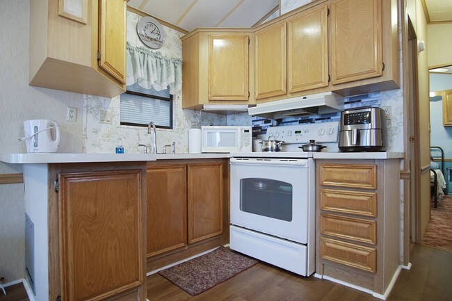 Building Photo - Home in 55+ Community now available!