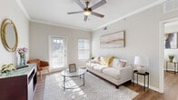 Located in Austin, TX 78729, this well-appointed one-bedroom, one-bathroom residence offers a thoughtfully designed single-level layout that maximizes every square foot. The bright living area welcomes natural light through multiple windows and a private exterior door, and features crown molding, a ceiling fan, and durable wood-style flooring that flows throughout the home. The kitchen is outfitted with rich wood cabinetry, light countertops, black appliances including a range, microwave, refrigerator, and dishwasher, alongside a convenient pantry with louvered bifold doors for extra storage. The bedroom is a comfortable retreat, featuring a ceiling fan, a natural light-filled window, built-in shelving, and ample space. A dedicated closet provides generous storage. The full bathroom includes a single-sink vanity with wood cabinetry, a tiled tub-shower combination, and wood-style flooring. Additional highlights include an in-unit laundry area and neutral, warm-toned walls throughout that lend a clean, cohesive aesthetic. The overall ambiance is bright, functional, and move-in ready, making this an ideal space in the heart of the Austin area.