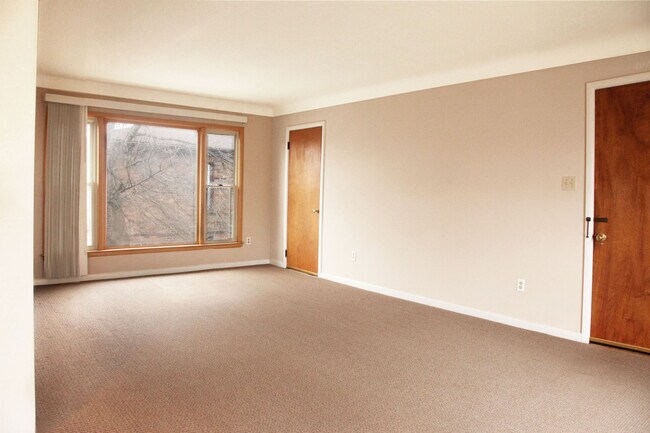 Living room, closet door. - 1421 W Farnum Ave
