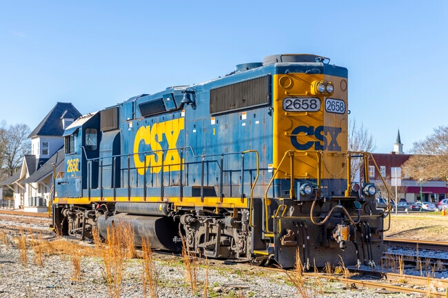 Trains arrive and depart regularly from Franklin Train Station, bustling with activity.