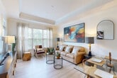 Located at 1740 Century Circle in Chamblee, GA, this one-bedroom, one-bathroom residence offers a well-designed single-floor layout that maximizes every square foot. The open-concept living and dining area is anchored by a tray ceiling with crown molding and large windows that flood the space with natural light, offering views of surrounding greenery. Light-toned hardwood-style flooring runs throughout the main living areas, enhancing the bright and airy ambiance.

The kitchen features warm wood cabinetry, granite countertops, a subway tile backsplash, stainless steel appliances, and pendant lighting over a peninsula breakfast bar — ideal for casual dining. A separate pantry and dedicated dining area provide additional functionality.

The bedroom is generously proportioned, accommodating a full suite of furniture with ease. It includes a ceiling fan, large windows with natural views, and access to ample closet storage. The full bathroom is finished with granite countertops, tile flooring, and a tub/shower combination.

Additional highlights include four closets, a dedicated laundry area, and a utility room, ensuring practical storage throughout. The overall aesthetic is clean, neutral, and move-in ready.