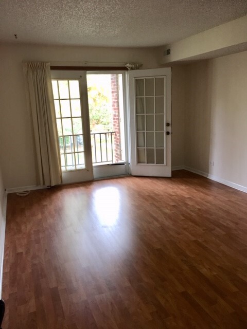 Bedroom with french doors leading to the balcony - 520 Biesterfield Rd